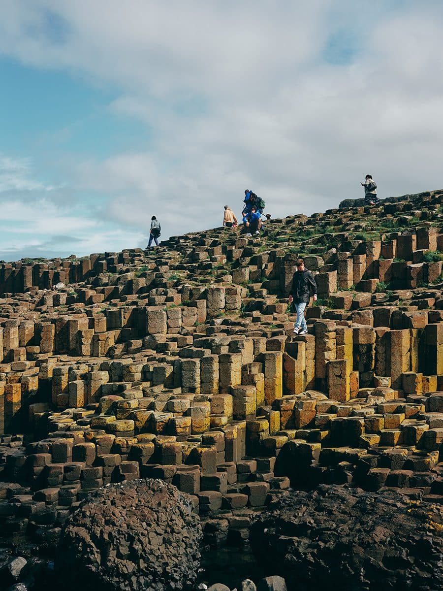 people exploring Giants Causeway