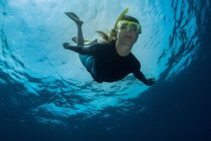 woman diving in the ocean